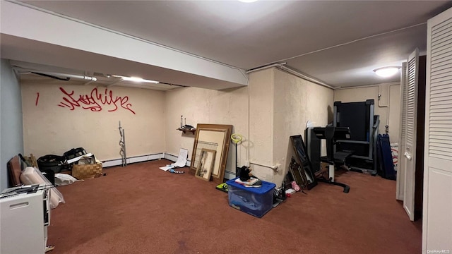 workout area featuring carpet flooring and baseboard heating