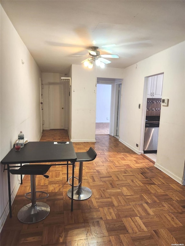 interior space featuring dark parquet floors and ceiling fan