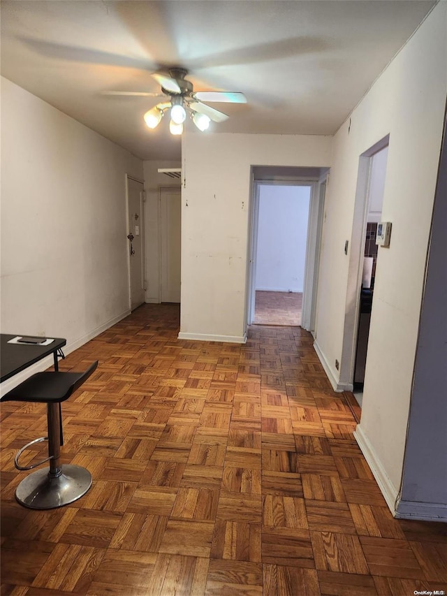 corridor featuring dark parquet flooring