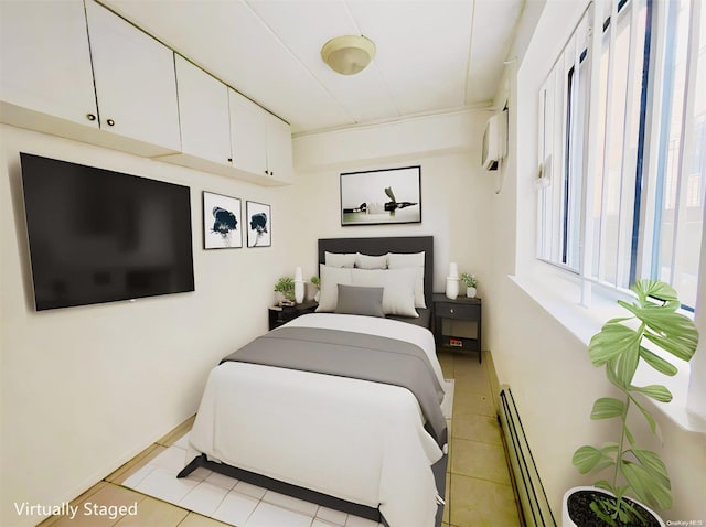 tiled bedroom with a wall unit AC and baseboard heating