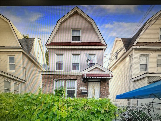 117-63 140th St, Jamaica, NY 11436 - view of front of house featuring a gambrel roof and brick siding