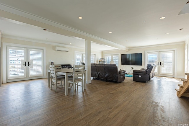 dining room with french doors, hardwood / wood-style flooring, a wall mounted AC, and crown molding