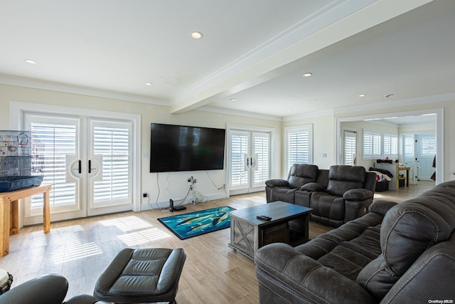 living room with beamed ceiling, french doors, crown molding, and light hardwood / wood-style flooring