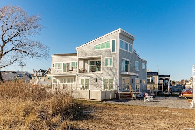 rear view of house featuring a balcony