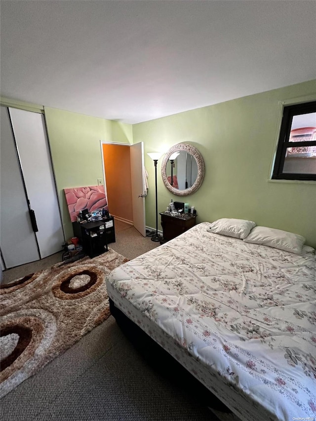 carpeted bedroom with a closet