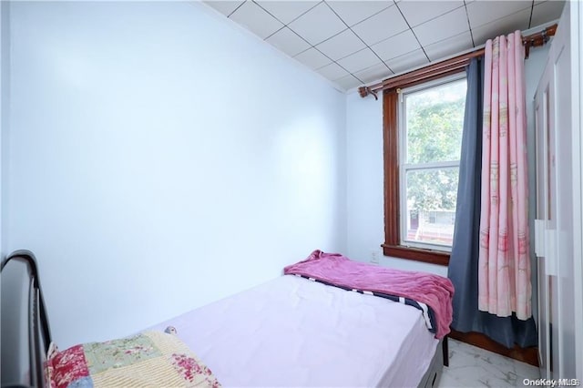 bedroom featuring a drop ceiling