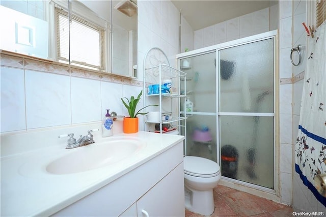 bathroom featuring vanity, decorative backsplash, toilet, tile walls, and an enclosed shower