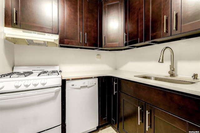 kitchen featuring sink and white appliances