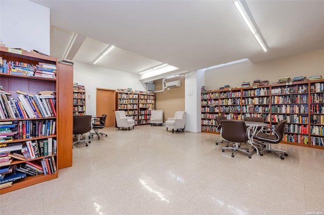 office space with a wall mounted air conditioner