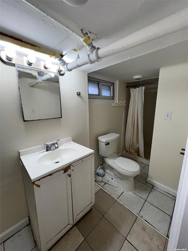 bathroom with tile patterned flooring, vanity, toilet, and a shower with shower curtain