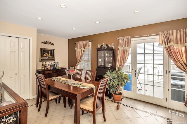 dining area with light tile patterned floors