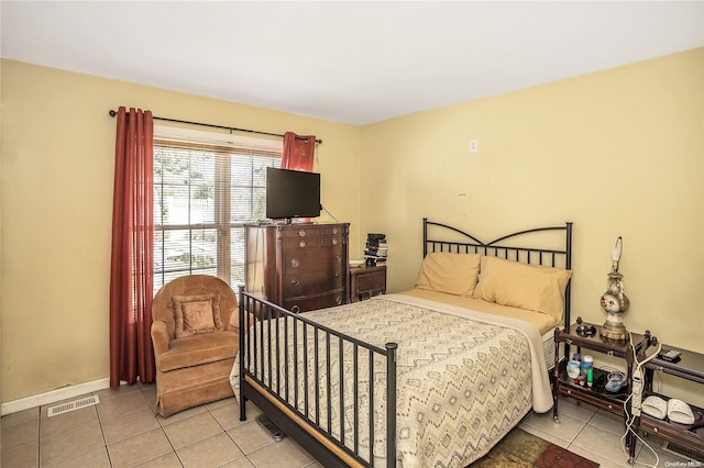 bedroom featuring light tile patterned flooring