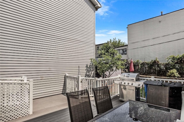 wooden deck featuring area for grilling