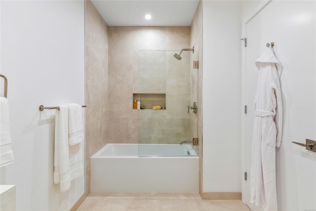 bathroom featuring combined bath / shower with glass door