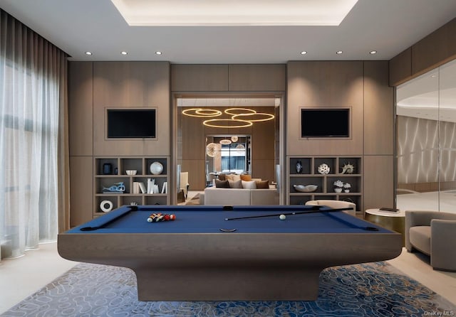 recreation room featuring built in shelves, recessed lighting, pool table, and a tray ceiling