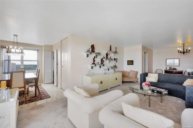 living room featuring light colored carpet and a notable chandelier