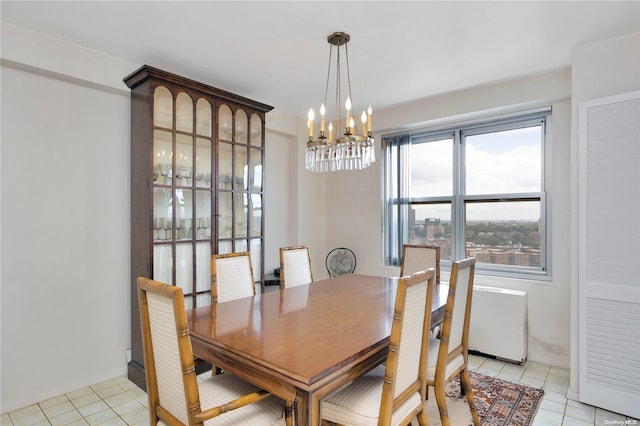 dining room with a notable chandelier and light tile patterned flooring