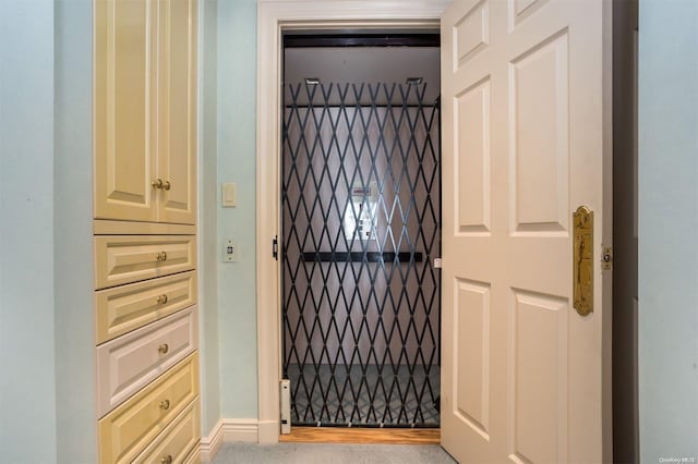 doorway to outside featuring elevator