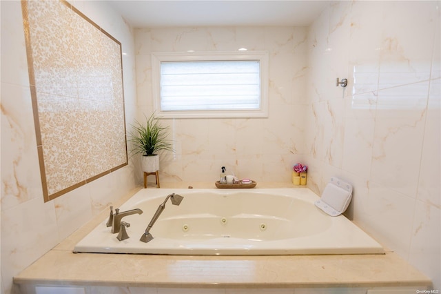 bathroom with tiled bath and tile walls