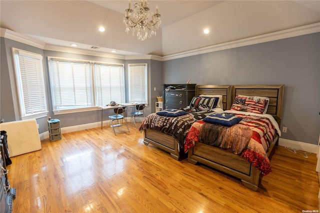 bedroom with light hardwood / wood-style flooring, ornamental molding, lofted ceiling, and an inviting chandelier