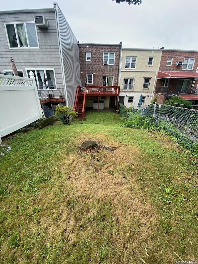 view of yard featuring a wooden deck