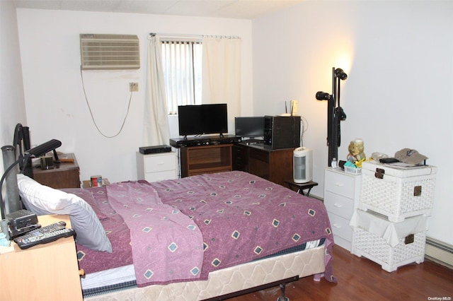 bedroom featuring a wall mounted AC and dark wood-type flooring