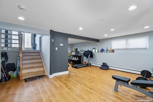 workout area with wood-type flooring