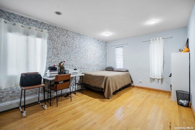 bedroom featuring light wood-type flooring