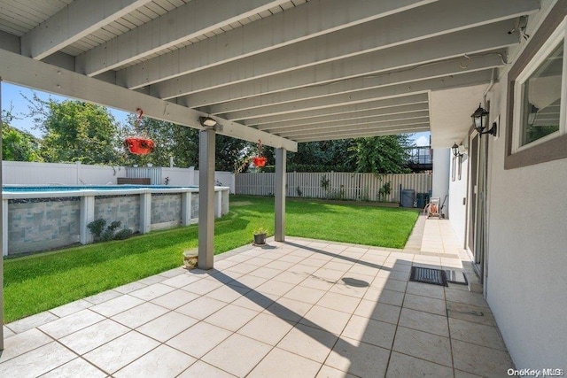 view of patio with a fenced in pool