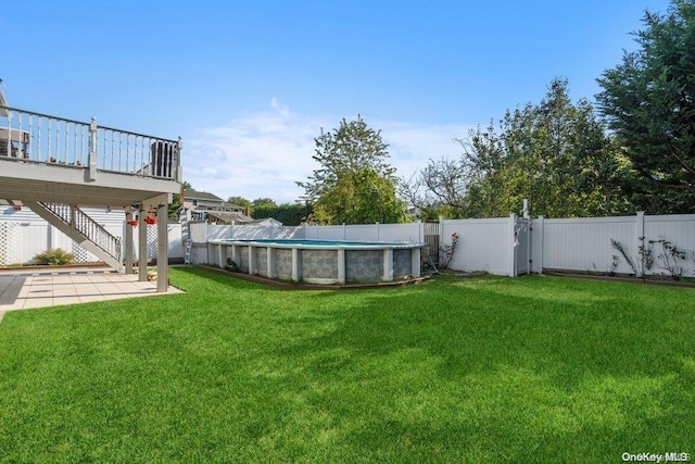 view of yard featuring a swimming pool side deck