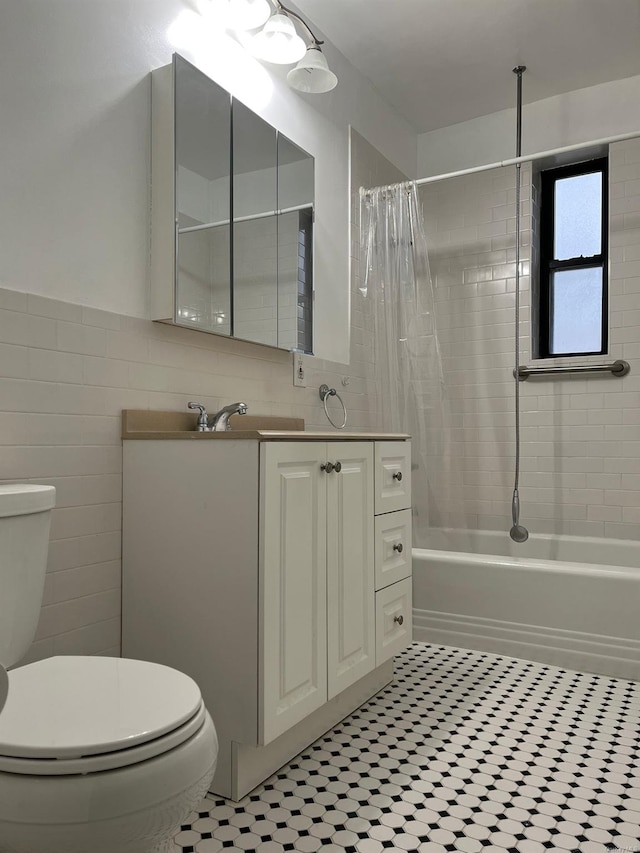 full bathroom featuring vanity, tile patterned floors, toilet, shower / bathtub combination with curtain, and tile walls