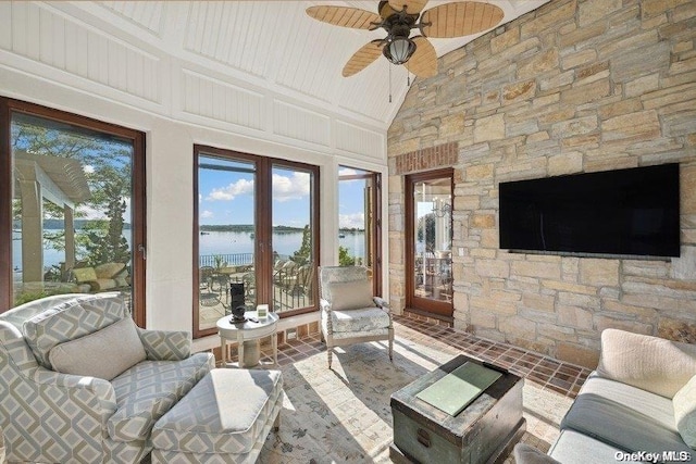 sunroom with ceiling fan, beam ceiling, and wooden ceiling