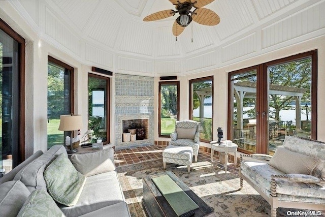 sunroom / solarium featuring ceiling fan