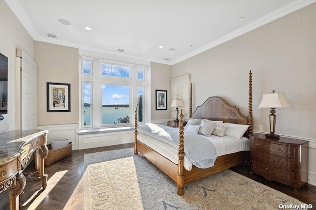 bedroom with wood-type flooring, a water view, and crown molding