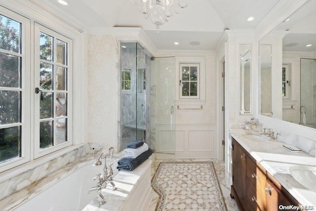 bathroom with crown molding, vanity, a chandelier, and shower with separate bathtub