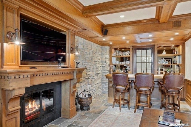 bar featuring beamed ceiling, ornamental molding, and coffered ceiling