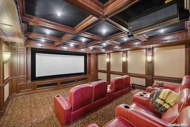 home theater room with carpet flooring, beam ceiling, ornamental molding, and coffered ceiling