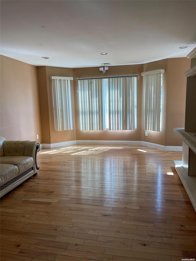 unfurnished living room with light wood-type flooring