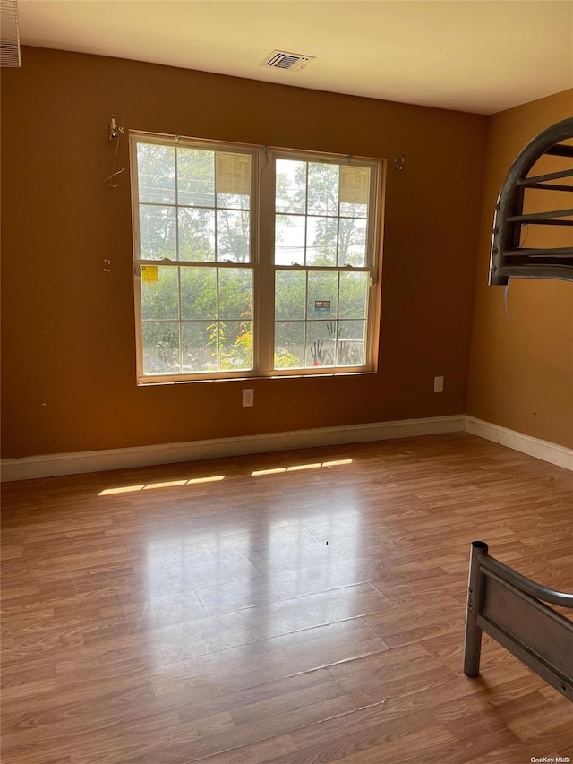 empty room featuring hardwood / wood-style flooring