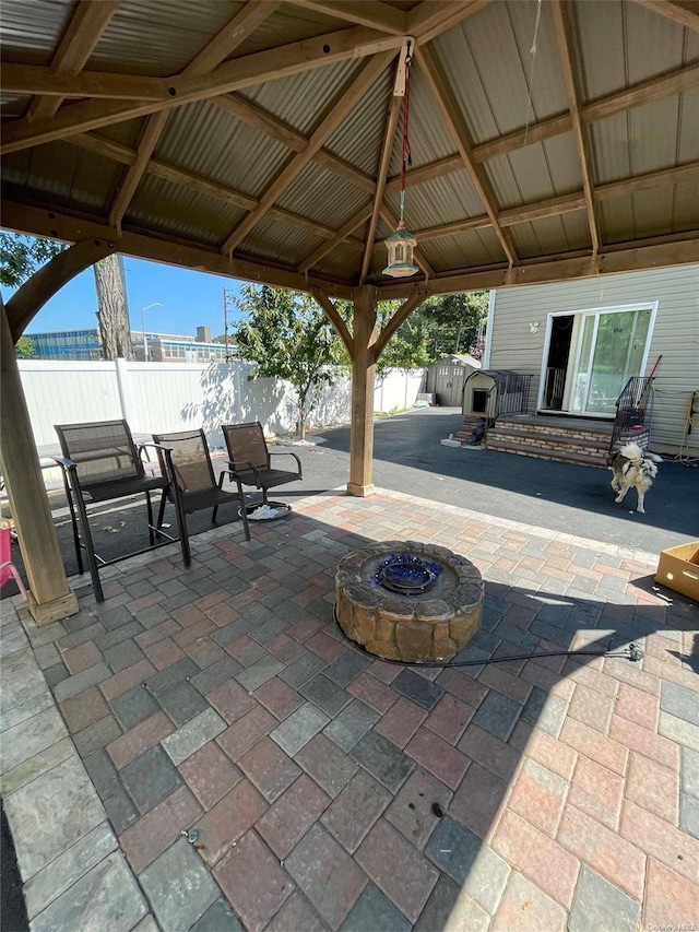 view of patio featuring a gazebo and an outdoor fire pit