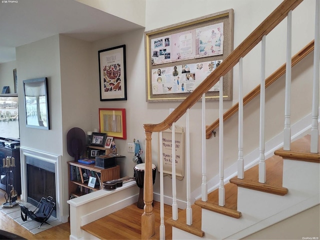 staircase featuring hardwood / wood-style flooring