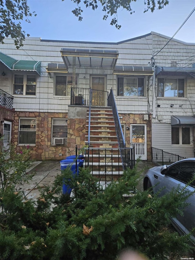 rear view of house with cooling unit