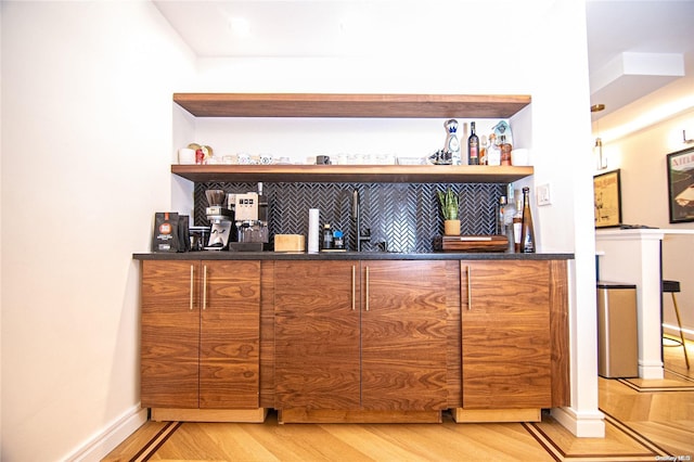 bar featuring light hardwood / wood-style flooring