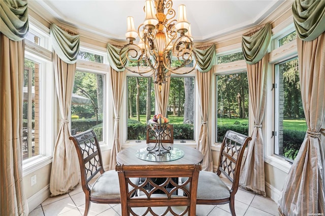 sunroom featuring an inviting chandelier