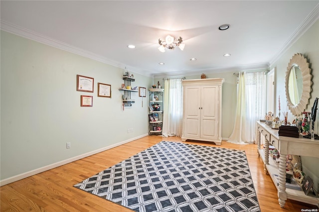 foyer with ornamental molding and hardwood / wood-style flooring