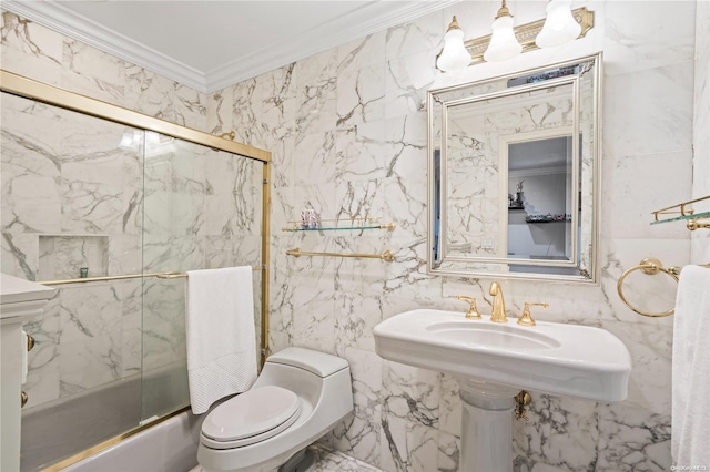 bathroom with toilet, tile walls, ornamental molding, and bath / shower combo with glass door