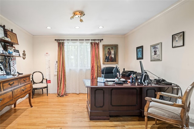 office area with light hardwood / wood-style floors and crown molding