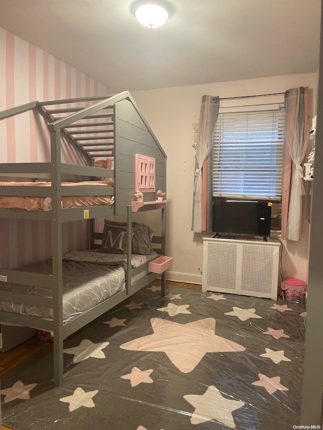 bedroom with radiator heating unit