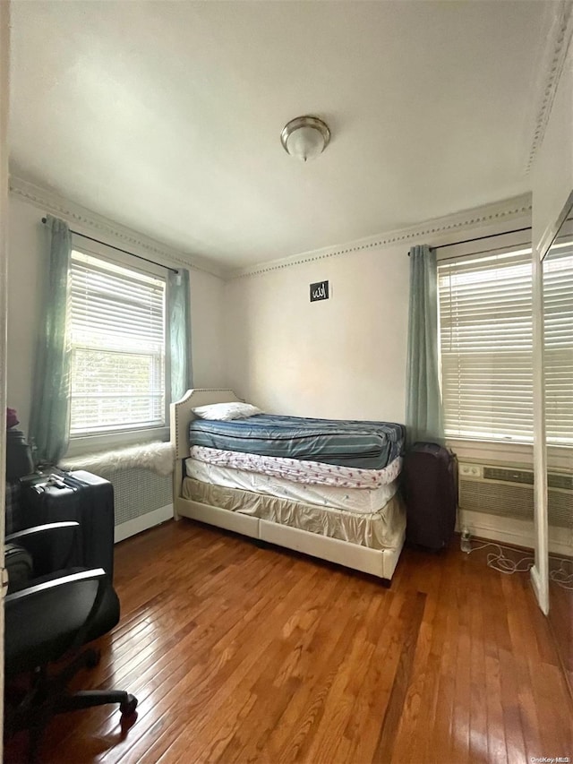 bedroom featuring wood-type flooring