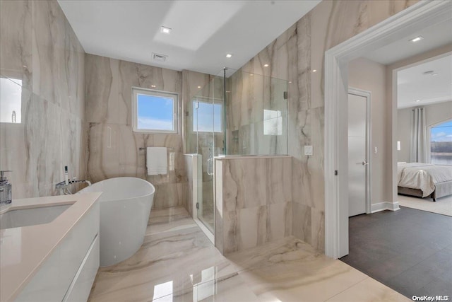 bathroom with separate shower and tub